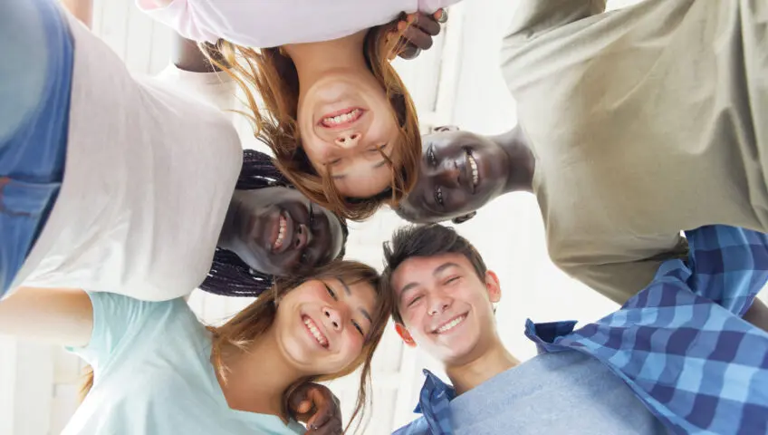 Multi-ethnic teens in a circle