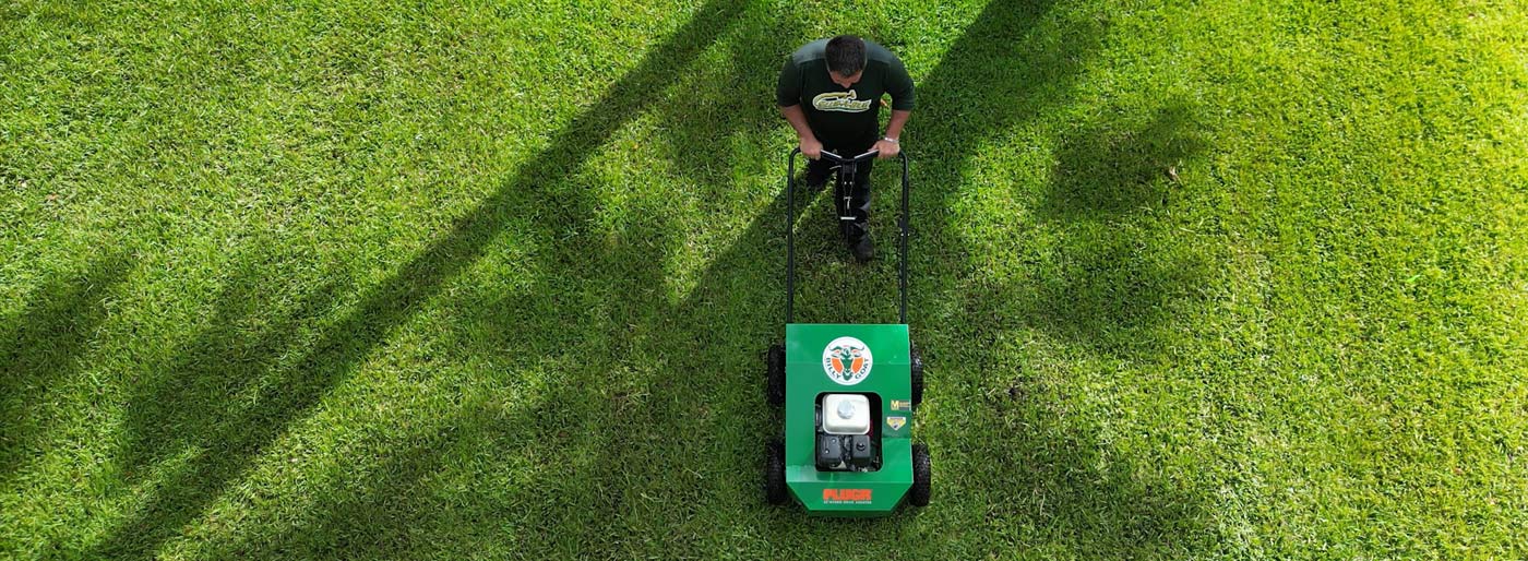 Slug-A-Bug Aerating a Melbourne Florida Lawn